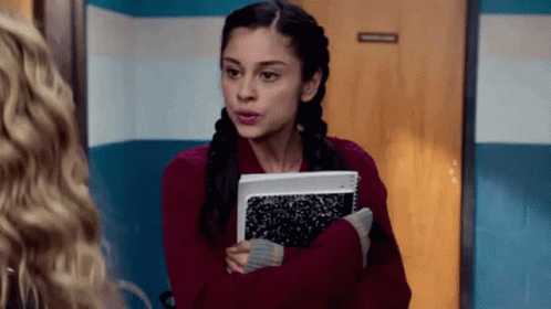 Woman In Red Sweater Holding Notebook GIF