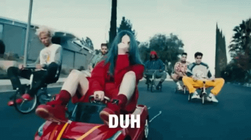 Woman In Red Sweater Sitting In Red Car With Duh GIF