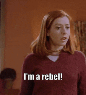 A Woman In A Red Sweater Says I 'M A Rebel . GIF