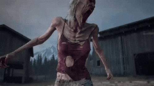 A Woman In A Red Tank Top Is Standing In Front Of A Barn . GIF
