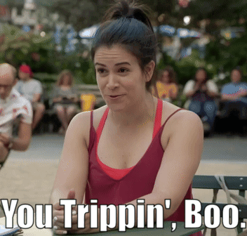 A Woman In A Red Tank Top Sits At A Table With The Words You Trippin ' Boo Written Below Her GIF
