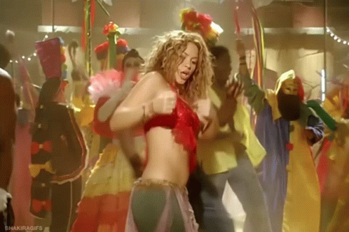 A Woman In A Red Top Is Dancing In A Crowd . GIF