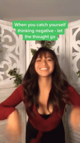 A Woman In A Red Top Is Dancing With A Caption That Says " When You Catch Yourself Thinking Negative Let The Thought Go GIF