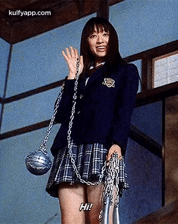 A Woman In A School Uniform Is Holding A Chain And A Rope . GIF