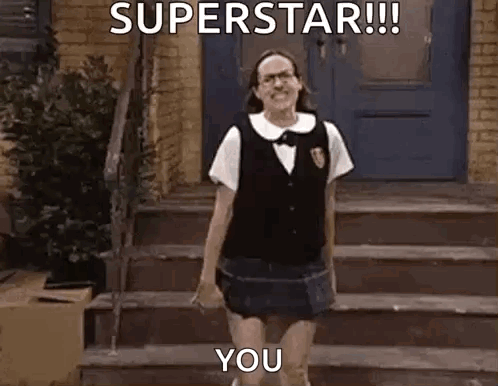 A Woman In A School Uniform Is Standing On A Set Of Stairs And Says `` Superstar !!! You '' . GIF