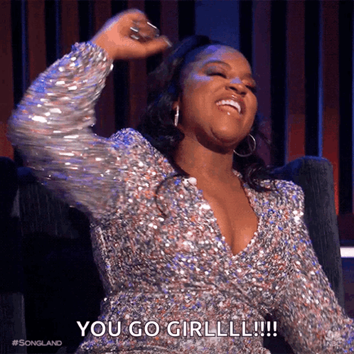 A Woman In A Sequined Dress Is Laughing And Saying You Go Girllll !!! GIF