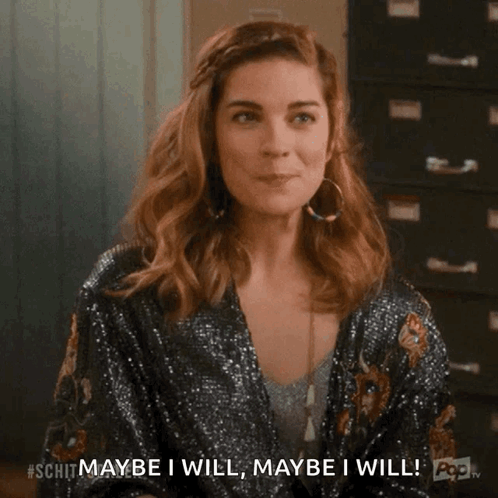 Woman In Sequined Jacket Saying Maybe I Will GIF