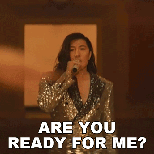 A Woman In A Sequined Suit Is Singing Into A Microphone And Says " Are You Ready For Me ? " GIF