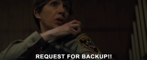 a woman in a sheriff 's uniform is asking for a backup