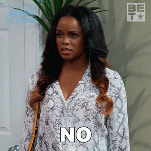 A Woman In A Snake Print Shirt Has The Word No On Her Chest GIF