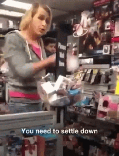 A Woman In A Store With The Words You Need To Settle Down GIF