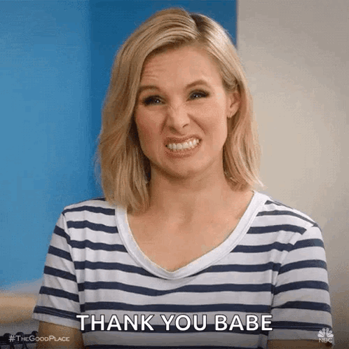 A Woman In A Striped Shirt Is Making A Funny Face And Saying Thank You Babe . GIF