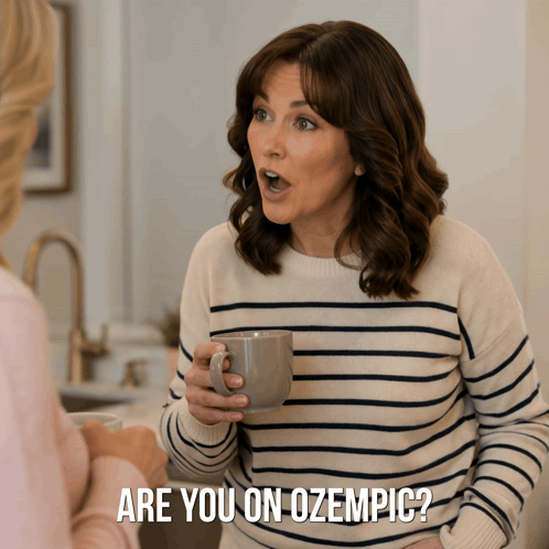 A Woman In A Striped Sweater Is Holding A Cup Of Coffee And Says Are You On Ozempic GIF