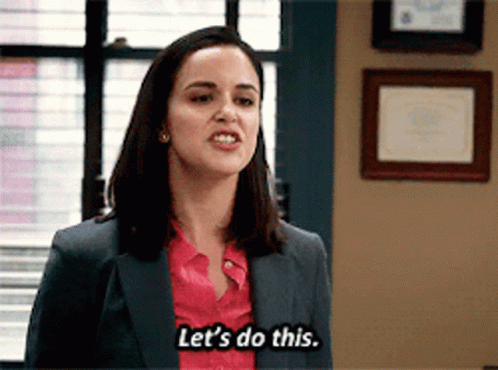 A Woman In A Suit And Pink Shirt Says Let 'S Do This . GIF