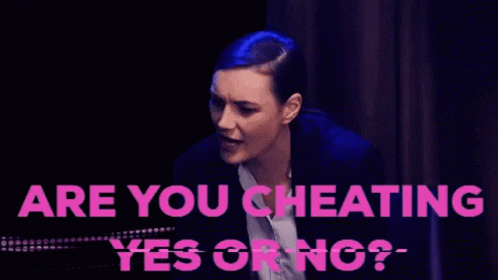 A Woman In A Suit Is Being Asked If She Is Cheating On Her Husband GIF
