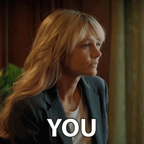 A Woman In A Suit Is Saying You GIF