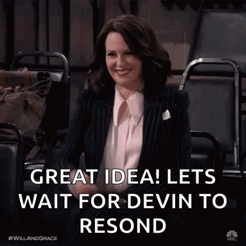 A Woman In A Suit Is Sitting In A Chair With The Words Great Idea Lets Wait For Devin To Resend Below Her GIF