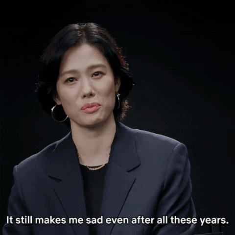a woman in a suit says it still makes her sad even after all these years