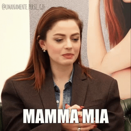 A Woman In A Suit Says Mamma Mia GIF
