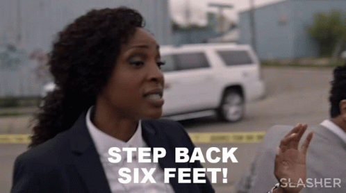 A Woman In A Suit Says " Step Back Six Feet " In Front Of A White Suv GIF