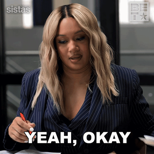 A Woman In A Suit Says Yeah Okay While Holding A Red Pen GIF