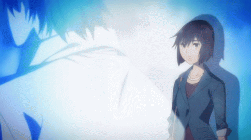 A Woman In A Suit Stands In Front Of A Blue Background GIF