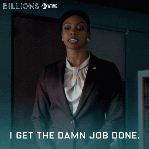 A Woman In A Suit With The Words I Get The Damn Job Done On The Bottom GIF