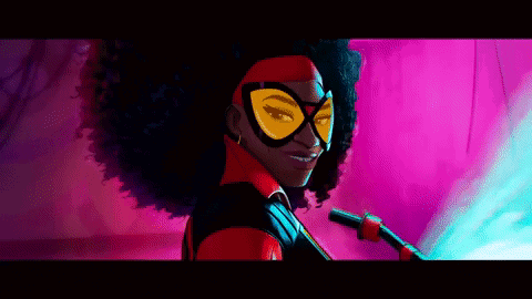 A Woman In A Superhero Costume Is Smiling GIF