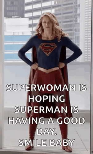 A Woman In A Superhero Costume Is Standing In Front Of A Window With Her Hands On Her Hips . GIF