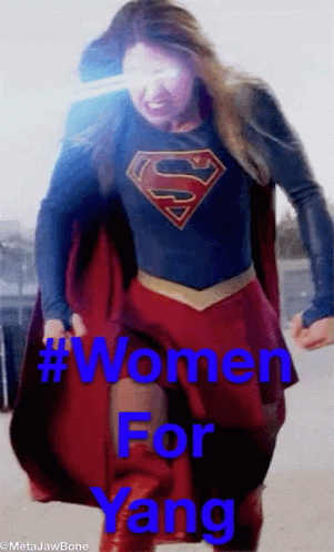 A Woman In A Superman Costume With The Words Women For Yang On The Bottom GIF