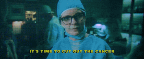 A Woman In A Surgical Gown With The Words " It 'S Time To Cut Out The Cancer " Above Her GIF