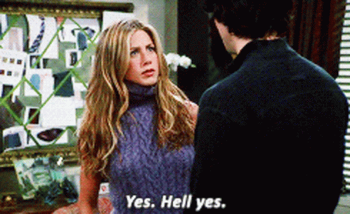 A Woman In A Sweater Says Yes Hell Yes To A Man GIF