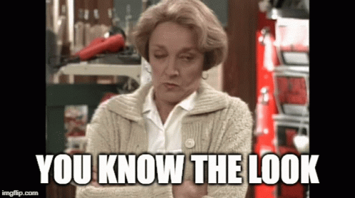 A Woman In A Sweater With The Words You Know The Look Written On It GIF