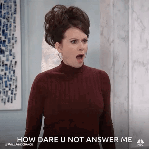 A Woman In A Turtleneck Sweater Is Making A Funny Face And Says `` How Dare U Not Answer Me '' . GIF