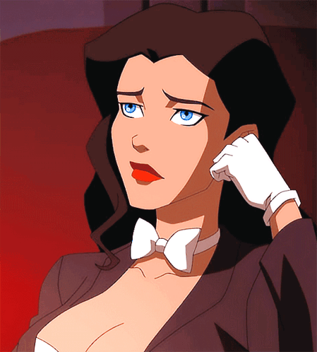 A Woman In A Tuxedo And Bow Tie Is Holding Her Hand To Her Face GIF