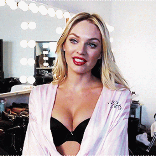 A Woman In A Victoria 'S Secret Robe And Black Bra GIF