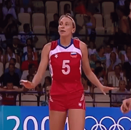a woman in a volleyball uniform with the number 5 on it