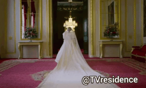 A Woman In A Wedding Dress Is Standing In A Room With The Words @Tvresidence Written Below Her GIF