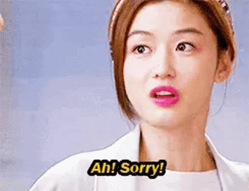 A Woman In A White Coat Is Making A Funny Face And Saying `` Ah ! Sorry ! '' GIF