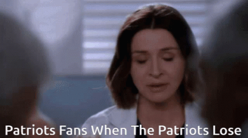 a woman in a white coat with the words patriots fans when the patriots lose above her