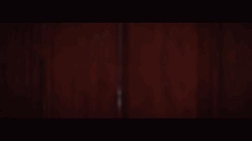 A Woman In A White Dress And Veil Is Smiling GIF