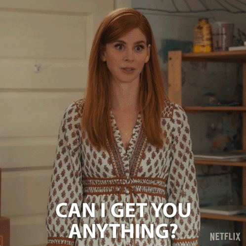 A Woman In A White Dress Is Asking If She Can Get You Anything GIF