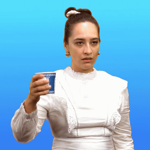 A Woman In A White Dress Is Holding A Cup That Says " Yogurt " GIF