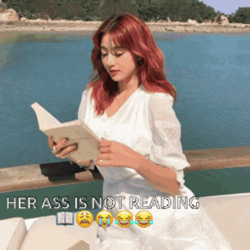 A Woman In A White Dress Is Reading A Book With The Words Her Ass Is Not Reading Above Her GIF