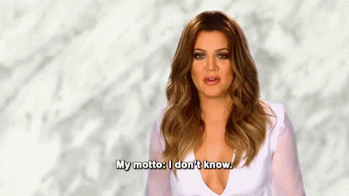 A Woman In A White Dress Is Saying `` My Motto : I Don 'T Know . '' GIF