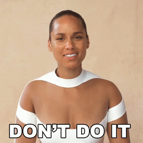 A Woman In A White Dress Is Smiling And Says " Don 'T Do It " GIF