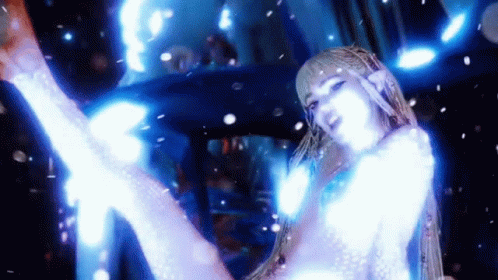 A Woman In A White Dress Is Surrounded By Blue Lights And Is Dancing . GIF