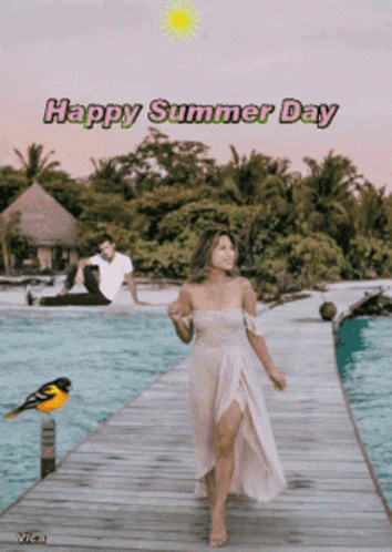 A Woman In A White Dress Is Walking On A Dock With A Man Sitting On The Beach Behind Her And The Words Happy Summer Day GIF