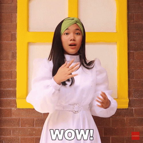 A Woman In A White Dress Says Wow GIF