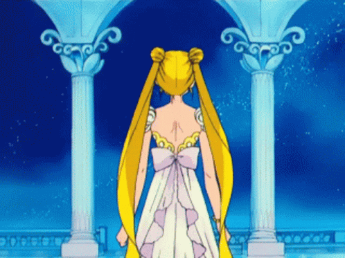 A Woman In A White Dress With A Bow On The Back GIF